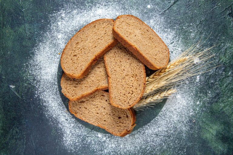 top-view-dark-bread-loafs-dark-desk